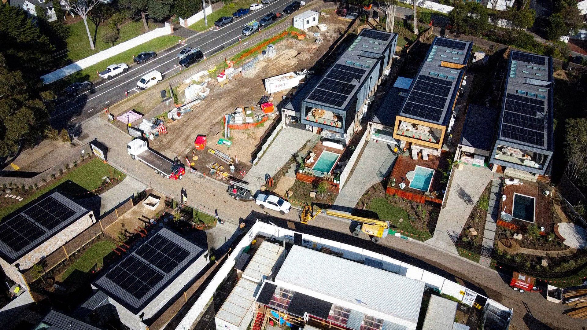 Aerial view of the five houses and site compound on The Block